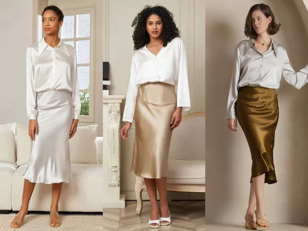 Three models wearing silk button-down shirts paired with silk midi skirts. Left: all-white ensemble with fitted skirt. Center: white shirt with champagne silk skirt. Right: light gray silk shirt with gold/bronze silk midi skirt