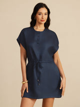 [Dark Blue] navy blue cap-sleeve short dress with drawstring waist and pockets, waist-up view, model with both arms relaxed. 001