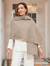 [Dark Khaki] dark khaki rectangular shawl with fringed edges, styled front view, draped over the shoulders with hand holding an edge. 003