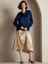 [Dark Blue] Navy blue women's long-sleeve button-front shirt with pointed collar, full front view, model with hands loosely clasped. 003
