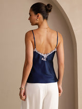 [Dark Blue] Waist-up back view of a navy blue mulberry silk camisole with spaghetti straps and pale floral lace along the V neckline 002