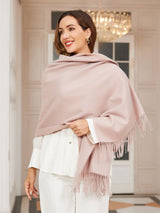[Light Beige] pale blush pink rectangular shawl with fringed edges, styled front view, over shoulders, hand at hair. 003