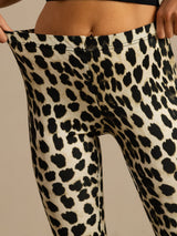 [Leopard] High-rise flared trousers with a black-and-cream leopard print in a full front view, with the lower hem visible. 004