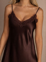 [Brown] Close studio view of a model wearing a chocolate-brown spaghetti-strap mini slip nightdress with lace trim. 004