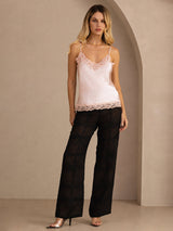 [Pink] Pale pink lace-trim camisole in a full front view, with both arms down and feet apart. 006