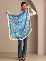[Blue Fish] Held-open front view of a 90 cm square silk scarf in bright blue with multicolor fish motifs and a pale patterned border 003