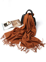 [Brown] warm brown rectangular shawl with fringed edges, flat lay, loosely draped beside a handbag and small accessories. 005