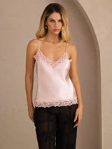 [Pink] Pale pink lace-trim V-neck camisole top on a model in a mid-length front view with arms relaxed and shoulders square. 001