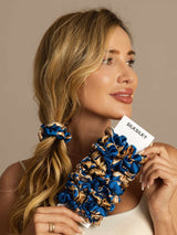 [Navy Dragon] Blue and gold mulberry silk hair scrunchies held by a woman with ponytail 001