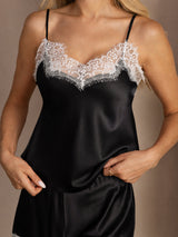 [Black] Close-up of black lace-trim camisole and ruffled shorts, showing a lace neckline and lace-trim shorts hems. 004