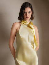 [Light Yellow] The model faces forward in a pale yellow scarf-neck maxi dress, framed from the upper body. 004
