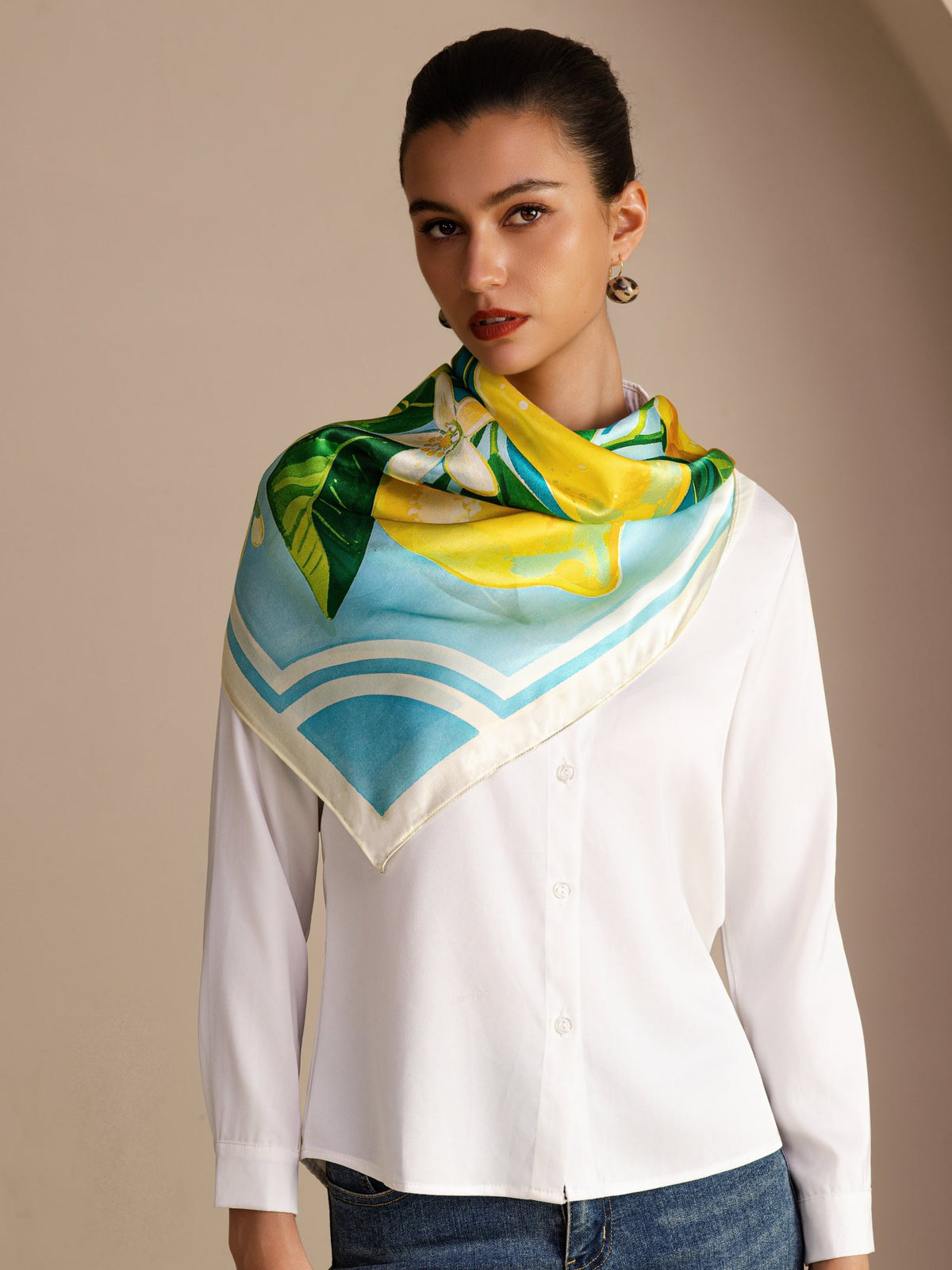 [Blue Lemon] Aqua-and-white square lemon scarf with green leaves and pale border, styled front view, tied at neck, point on chest. 002