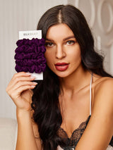 [Deep Purple] Purple silk scrunchies set with SilkSilky packaging held by model 002