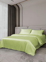 [Mint Green] Lime green silk bedding set with duvet cover, flat sheet, and two pillowcases on a modern bed 002