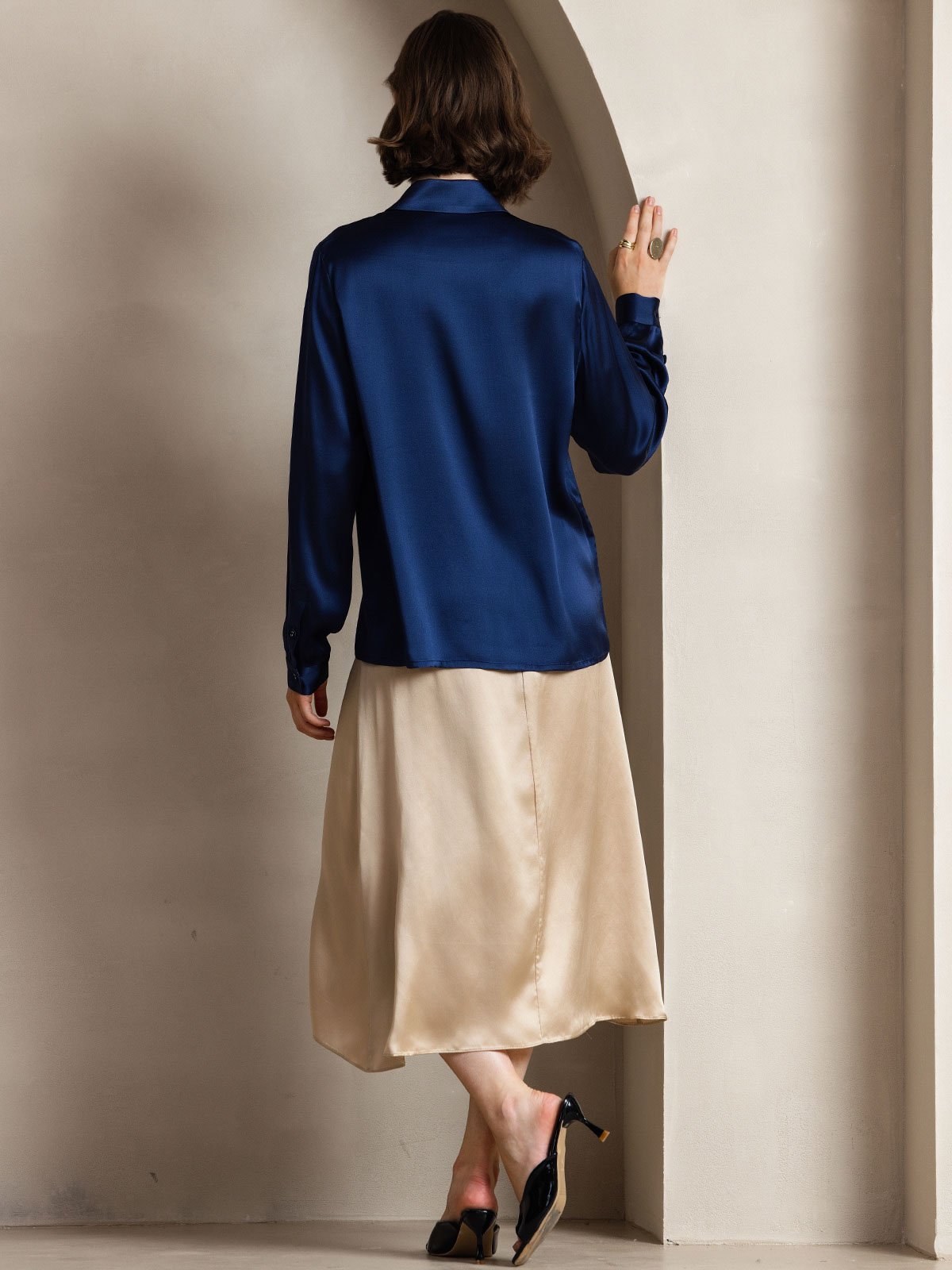 [Dark Blue] Full-length back view of a women's 19 momme silk long-sleeve button-front shirt with pointed collar in navy blue 002