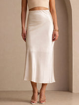 [Beige] Cream glossy maxi skirt on a model in a waist-to-ankle front crop with both legs straight and close together. 001