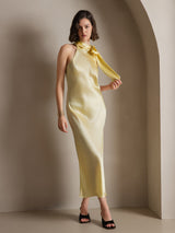 [Light Yellow] The model shifts onto one leg in a pale yellow scarf-neck maxi dress, with the lower hem visible. 006