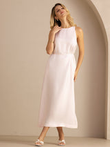 [Light Pink] light blush pink sleeveless scoop-neck midi dress, gathered waist and side pockets, full front view, hand beside face. 004