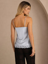 [Grayish Blue] Mid-length back studio view of a model wearing pale blue lace-trim spaghetti-strap camisole. 002