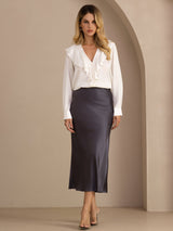 [Dark Gray] Charcoal gray glossy maxi skirt on a model in a full-body front view with arms relaxed and feet close together. 003