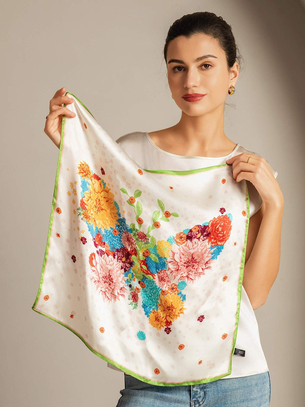 [P091] Model holding white Mulberry silk square scarf with green trim and floral butterfly print 002