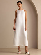 [White] white sleeveless scoop-neck midi dress, gathered waist and side pockets, full front view, model with both arms relaxed. 001