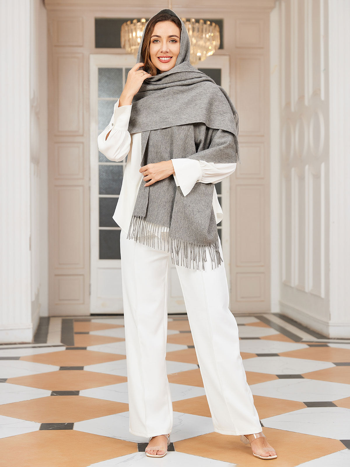 [Gray] medium gray rectangular shawl with fringed edges, styled front view, fringed ends down the front. 002