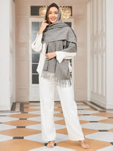 [Gray] medium gray rectangular shawl with fringed edges, styled front view, fringed ends down the front. 002