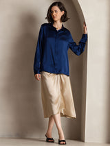 [Dark Blue] Navy blue women's long-sleeve button-front shirt with pointed collar, full front view, one hand touching the collar. 005