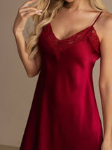 [Wine] Close studio view of a model wearing a wine-red spaghetti-strap mini slip nightdress with lace trim. 008