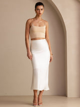 [Ivory] Ivory glossy maxi skirt on a model in a full-body front view with arms relaxed and feet close together. 006