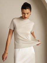 [Gray] Light gray short-sleeve crew-neck top with a white skirt in an angled view, with the model turned. 003