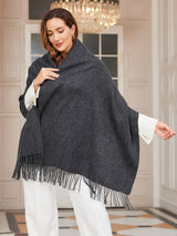[Dark Gray] dark charcoal gray rectangular shawl with fringed edges, styled front view, one side extended outward to show the width. 001
