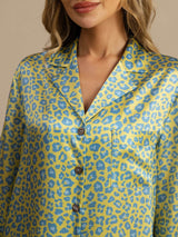 [Green Leopard] Close upper-body view of a mint-green leopard-print shirt dress, showing notched lapels, buttons, and chest pocket. 004