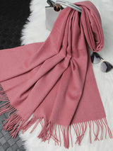 [Pale Mauve] pale mauve rectangular shawl with fringed edges, flat lay, loosely draped beside a handbag and small accessories. 005