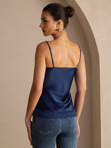 [Dark Blue] Mid-length back studio view of a model wearing navy blue lace-trim spaghetti-strap camisole. 002