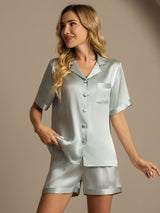 [Light Blue] Woman wearing light blue 100% mulberry silk short sleeve pajama set with button front and shorts 001