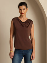 [Coffee] Angled view: coffee-brown sleeveless cowl-neck top with blue jeans, with the model turned sideways. 003