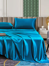 [Teal] Blue 25 momme mulberry silk sheet set with matching pillowcases on bed 006
