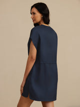 [Dark Blue] Waist-up back view of a mulberry silk cap-sleeve short dress with a drawstring waist and side pockets in navy blue 002