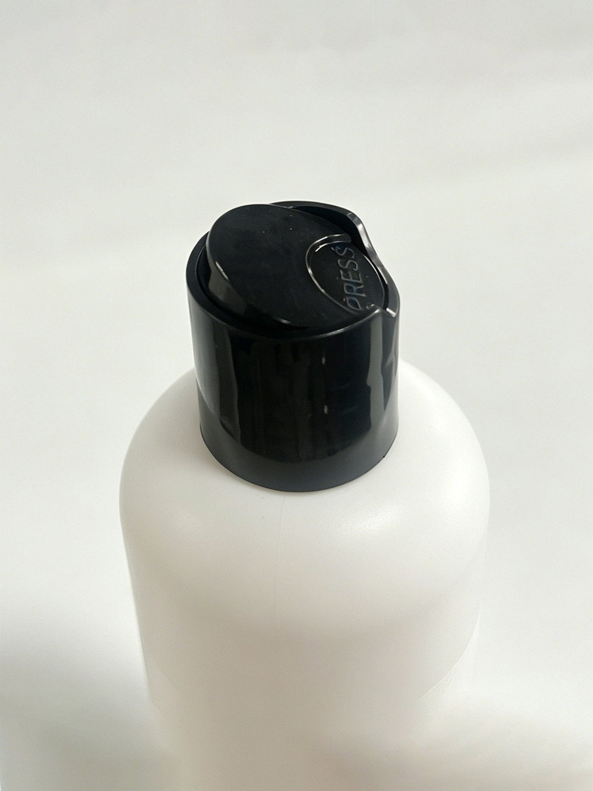 Black cap on SilkSilky 300ml laundry detergent bottle for silk care