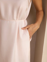 [Light Pink] Side-pocket detail of a silk midi dress with scoop neck, gathered waist, and side pockets in light blush pink 005