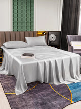 [Silver] Silver silk bed sheet set with pillowcases on modern bed 005