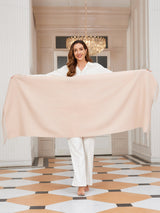 [Beige] Front view of the product held open: a rectangular wool shawl with fringed edges, 200 by 70 cm, in light beige 004