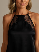 [Black] Close front view of a black halter camisole, showing black lace panels around the high neckline. 004