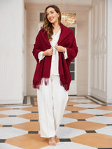 [Wine] wine red rectangular shawl with fringed edges, styled front view, wrapped at the neck with fringed ends down the front. 003