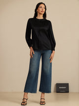 [Black] Black round-neck lantern-sleeve blouse on a model in a full-body front view with arms relaxed and feet close together. 005