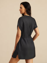 [Black] Waist-up back view of a mulberry silk cap-sleeve short dress with a drawstring waist and side pockets in black 002