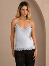 [Grayish Blue] Pale blue lace-trim V-neck camisole top on a model in a mid-length front view with arms relaxed and shoulders square. 003