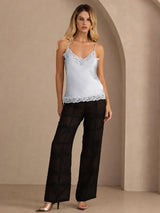 [Grayish Blue] Pale blue lace-trim camisole in a full front view, with both arms down and feet apart. 006